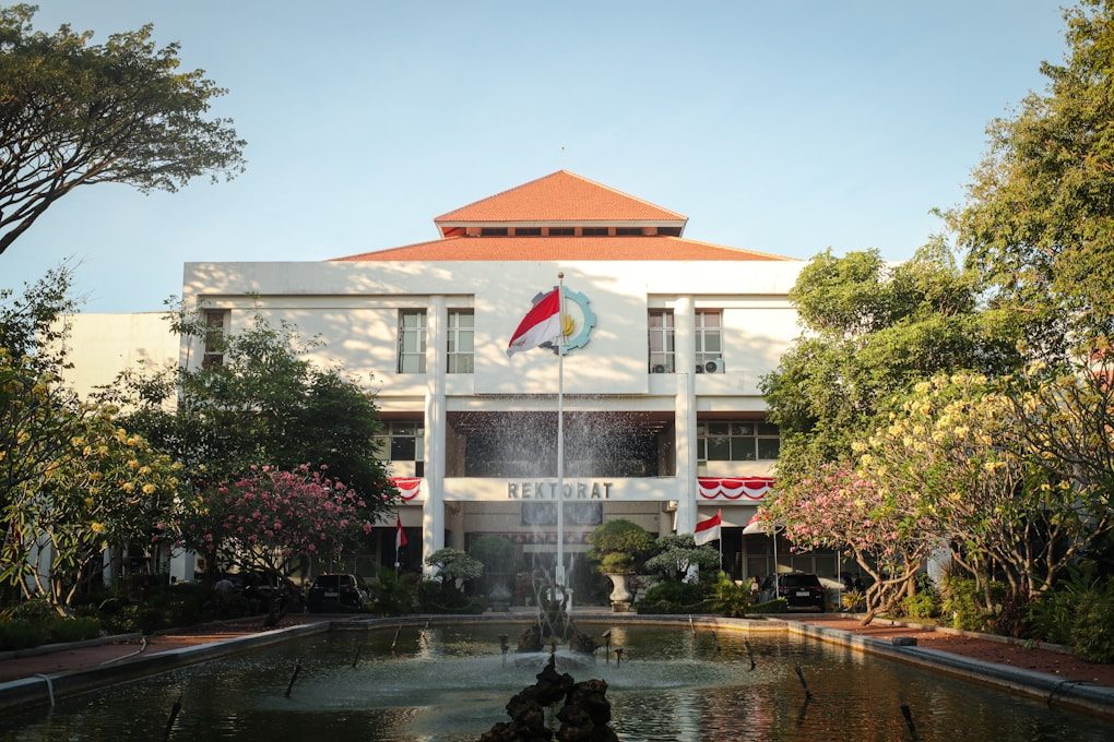 A building with a fountain in front of it