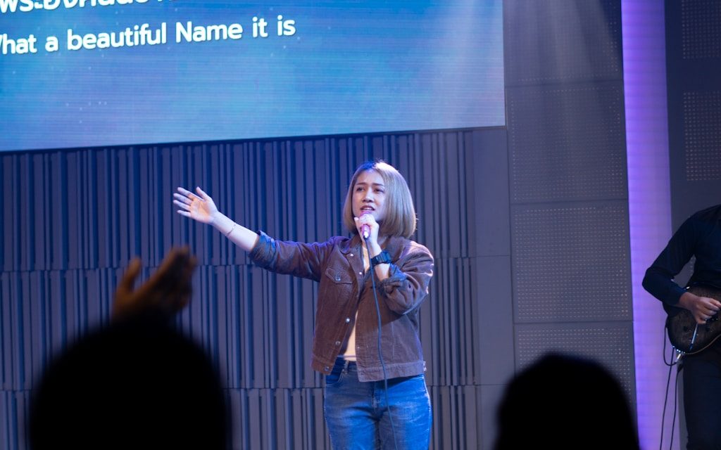 a person holding a microphone